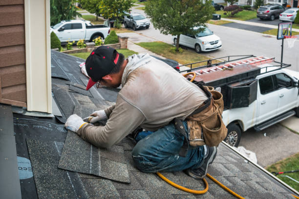 Professional Hail Damage Roof Repair technician working in Hettinger, ND